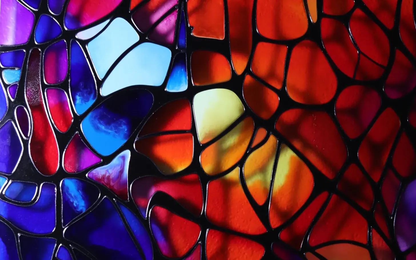 Detail of Ember Lattice: the raised black lattice, drawn by hand, with cells of color behind it.